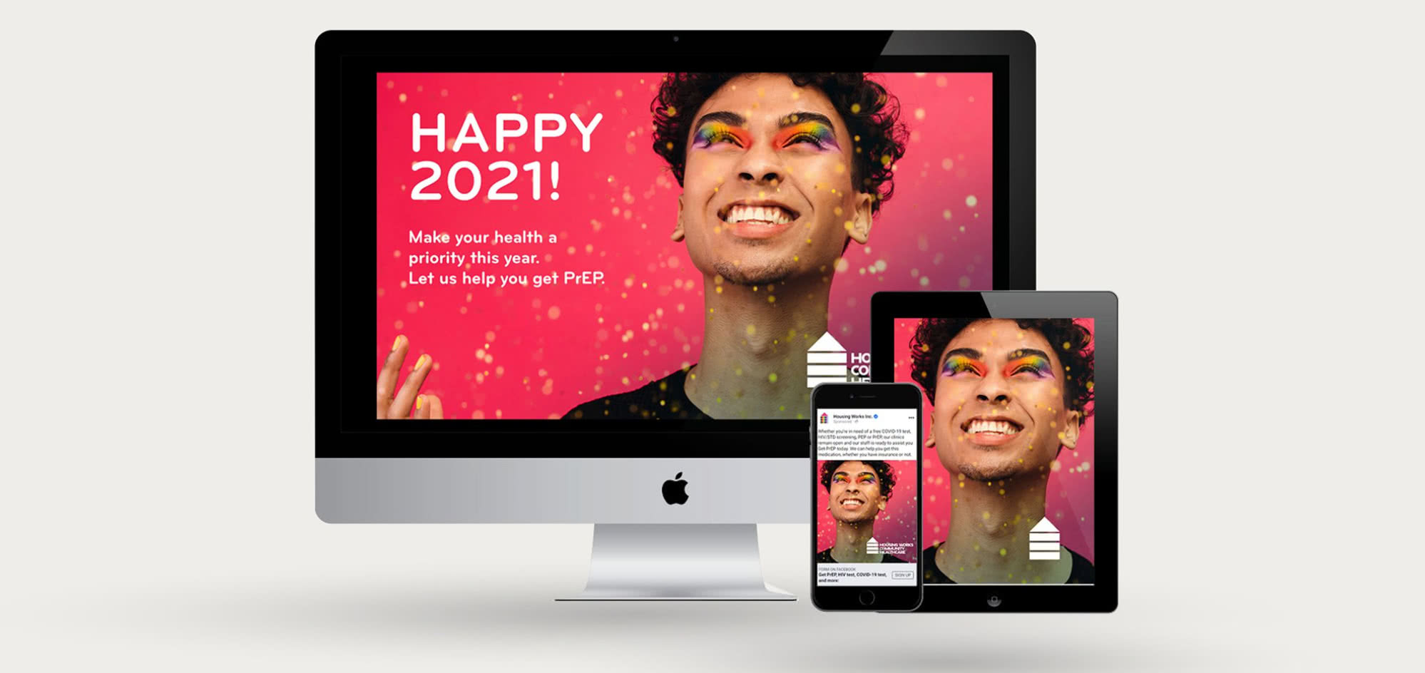 Screenshots on an iMac, iPad, iPhone of campaign featuring Smiling man with rainbow eye makeup. 
Text content: 
Happy 2021!  Make your health a priority this year.  Let us help you get PrEP.  Housing Works Logo.