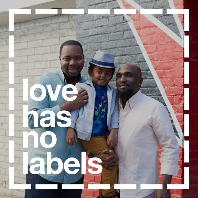 two fathers with their young boy with the caption "love has no labels"