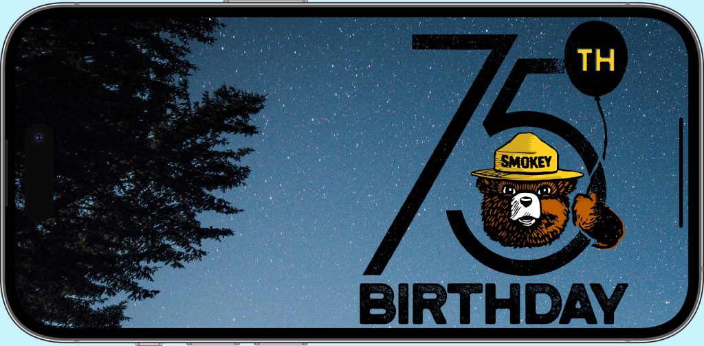 Smokey Bear 75th Birthday Campaign image on an iPhone screen. Smokey is holding a balloon and wearing his iconic hat.  